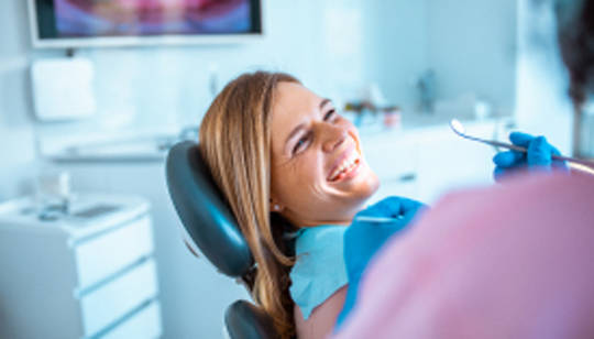 smiling patient in chair