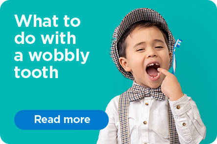 boy with a wobbly tooth