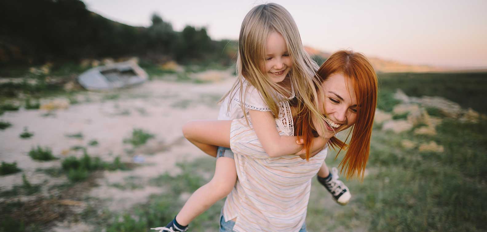 mother and daughter piggyback