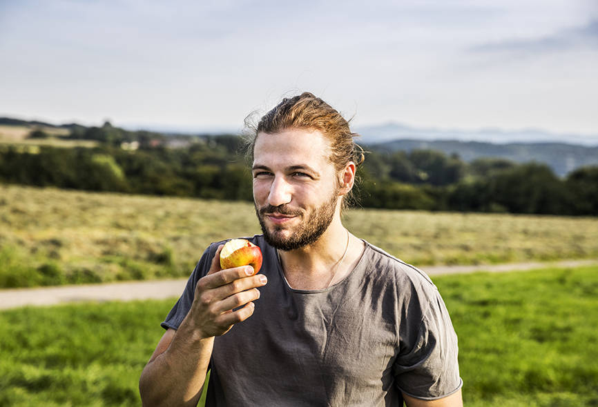 Man eating an apple