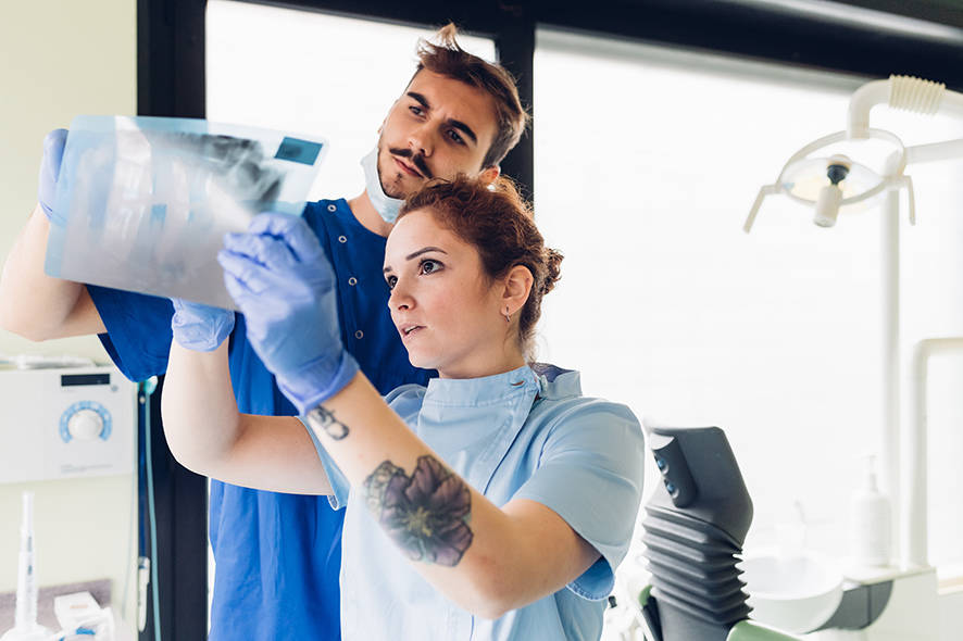 Dentists looking at an x-ray